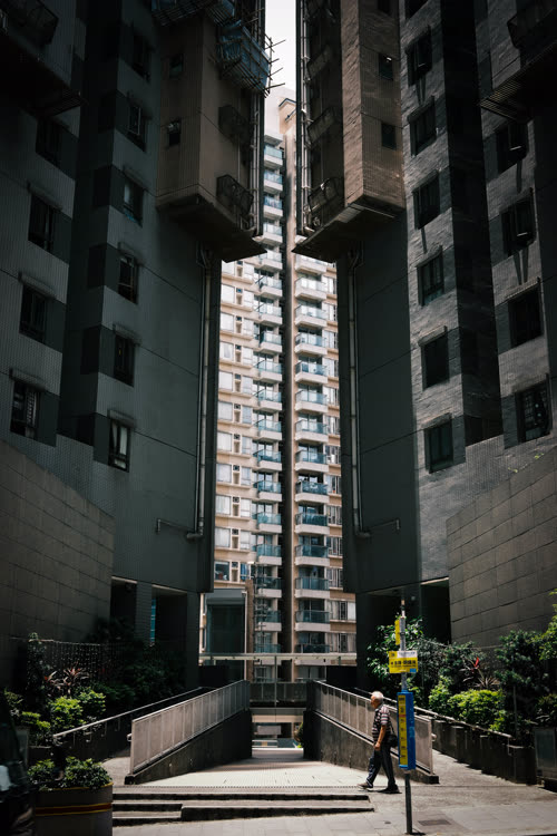 A narrow passage between apartment buildings